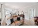 Open-concept living room showcasing hardwood floors and seamless transition to the kitchen at 112 E Spruce St, Orlando, FL 32804
