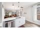 Open-concept kitchen and living room space with natural light and modern finishes at 112 E Spruce St, Orlando, FL 32804