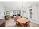 Open-concept dining and living space with hardwood floors and plenty of natural light at 112 E Spruce St, Orlando, FL 32804