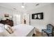 Bedroom with wood floors, fan and view into the bathroom at 112 E Spruce St, Orlando, FL 32804