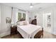 Bright bedroom with wood floors, large windows, and neutral decor at 112 E Spruce St, Orlando, FL 32804