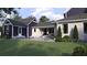 Inviting backyard with a sparkling pool and covered patio for outdoor living at 1207 Ridge Lake Way, Oakland, FL 34787
