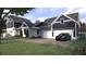 Beautiful home with a three-car garage and a well-manicured lawn at 1207 Ridge Lake Way, Oakland, FL 34787