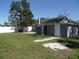 Backyard with a grey house and a white fence at 1600 Roosevelt Ave, Orlando, FL 32804