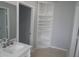 Well-organized bathroom featuring built in storage, modern vanity, and updated design at 1600 Roosevelt Ave, Orlando, FL 32804