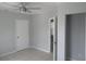 Bright bedroom with ceiling fan and tile flooring, offering a clean and modern look at 1600 Roosevelt Ave, Orlando, FL 32804