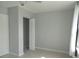 Functional bedroom featuring neutral paint, tile flooring, and closet space at 1600 Roosevelt Ave, Orlando, FL 32804