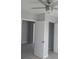 This bedroom offers tiled flooring and a ceiling fan at 1600 Roosevelt Ave, Orlando, FL 32804
