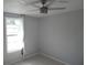 This bedroom has a ceiling fan and a large window at 1600 Roosevelt Ave, Orlando, FL 32804