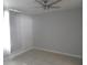 This bedroom has a ceiling fan and a large window at 1600 Roosevelt Ave, Orlando, FL 32804
