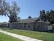 A cozy home with a well maintained lawn, a sturdy roof, and ample sunlight at 1600 Roosevelt Ave, Orlando, FL 32804