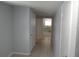 Hallway with neutral walls, tiled flooring and view to the kitchen at 1600 Roosevelt Ave, Orlando, FL 32804