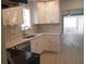 Well-lit kitchen featuring new countertops, stainless steel appliances, and a tiled backsplash at 1600 Roosevelt Ave, Orlando, FL 32804