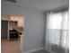 Comfortable living room featuring luxury vinyl plank floors and a view into the updated kitchen at 1600 Roosevelt Ave, Orlando, FL 32804