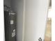 View of the hot water heater in utility closet with white walls at 1600 Roosevelt Ave, Orlando, FL 32804