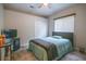 Bedroom with a queen bed, ceiling fan, and a closet at 1780 Nature Cove Ln, Clermont, FL 34711