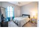 Bedroom with bed, a window with curtains, and dark furniture at 1780 Nature Cove Ln, Clermont, FL 34711