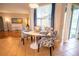 Charming dining area featuring an oval table, stylish chairs, and natural light at 1780 Nature Cove Ln, Clermont, FL 34711
