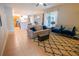Bright open concept living area with tile floors, sofa and chairs at 1780 Nature Cove Ln, Clermont, FL 34711
