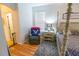Bedroom with four poster bed and accent chair at 1780 Nature Cove Ln, Clermont, FL 34711