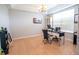 Home office features tile flooring, bright lighting and a sleek black desk at 1780 Nature Cove Ln, Clermont, FL 34711