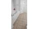 Bathroom featuring a soaking tub with tile surround and tile flooring at 1930 Dolphin Drive, Kissimmee, FL 34759