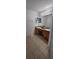 Bathroom featuring double sinks, a spacious mirror, and tile flooring at 1930 Dolphin Drive, Kissimmee, FL 34759