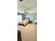 Cozy bedroom with carpet, ceiling fan, window and modern furnishings creates a calm and inviting atmosphere at 1930 Dolphin Drive, Kissimmee, FL 34759