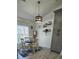 A cozy dining room has a decorative light fixture and an open layout at 1930 Dolphin Drive, Kissimmee, FL 34759