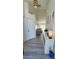 Bright entryway featuring hardwood-style floors leading into the home's interior at 1930 Dolphin Drive, Kissimmee, FL 34759