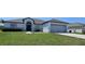 Charming one-story home featuring a gray roof, attached garage, and well-maintained front yard at 1930 Dolphin Drive, Kissimmee, FL 34759