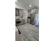 Bright kitchen with stainless steel appliances and gray cabinets at 1930 Dolphin Drive, Kissimmee, FL 34759