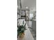 Bright kitchen with stainless steel appliances and gray cabinets, connected to a dining room at 1930 Dolphin Drive, Kissimmee, FL 34759