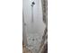 A shower with tiled walls and a marble-patterned floor, offering a clean and modern bathroom experience at 1930 Dolphin Drive, Kissimmee, FL 34759