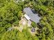 Aerial view of a home surrounded by lush greenery and mature trees, offering privacy at 220 Morton Ln, Winter Springs, FL 32708