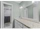 Bathroom features a vanity with a large mirror and a shower with glass doors at 220 Morton Ln, Winter Springs, FL 32708