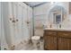 Small bathroom featuring a toilet and vanity with decorative shower curtain at 220 Morton Ln, Winter Springs, FL 32708