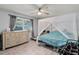 Bedroom boasts neutral walls, tile floors, and a ceiling fan for added comfort at 220 Morton Ln, Winter Springs, FL 32708