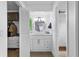 Bathroom features a stylish vanity, large mirror, and closet at 2485 Lakeway Branch Dr # 2105, Orlando, FL 32839