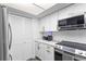 Bright kitchen with white cabinetry, modern appliances, and stylish countertops at 2485 Lakeway Branch Dr # 2105, Orlando, FL 32839