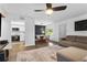 Open-concept living space connecting a cozy seating area to a dining table and modern kitchen at 2485 Lakeway Branch Dr # 2105, Orlando, FL 32839