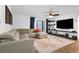 Spacious living room with a large sectional sofa and modern entertainment setup at 2485 Lakeway Branch Dr # 2105, Orlando, FL 32839