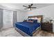 Comfortable main bedroom features a ceiling fan and natural light at 2485 Lakeway Branch Dr # 2105, Orlando, FL 32839