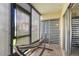 Relaxing screened patio with a hammock and privacy shades for outdoor enjoyment at 2485 Lakeway Branch Dr # 2105, Orlando, FL 32839