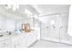 Modern bathroom features double vanity, walk-in shower with glass door, and a bright, spacious design at 2496 Rama Dr, Kissimmee, FL 34746