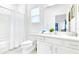 Modern bathroom with white fixtures, including a toilet, vanity, and shower/tub combination at 2496 Rama Dr, Kissimmee, FL 34746