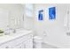 Clean, modern bathroom featuring white cabinets, marble floors, and a sleek countertop at 2496 Rama Dr, Kissimmee, FL 34746