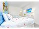A playful bedroom with twin beds, colorful decor, and a mounted television at 2496 Rama Dr, Kissimmee, FL 34746