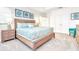Relaxing bedroom featuring a wooden bed frame, neutral color palette, and soft carpeting at 2496 Rama Dr, Kissimmee, FL 34746