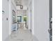 A bright hallway with marble floors leading to other areas of the home at 2496 Rama Dr, Kissimmee, FL 34746